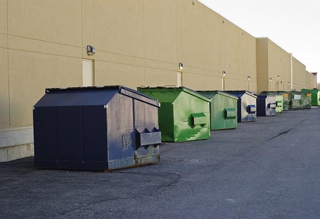 a crowd of dumpsters of all colors and sizes at a construction site in Antelope CA